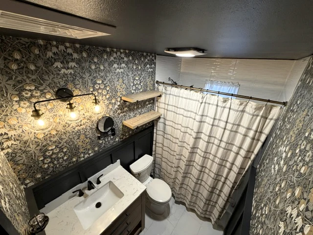 Bathroom remodel with floral wall finish, custom shelves and vanity