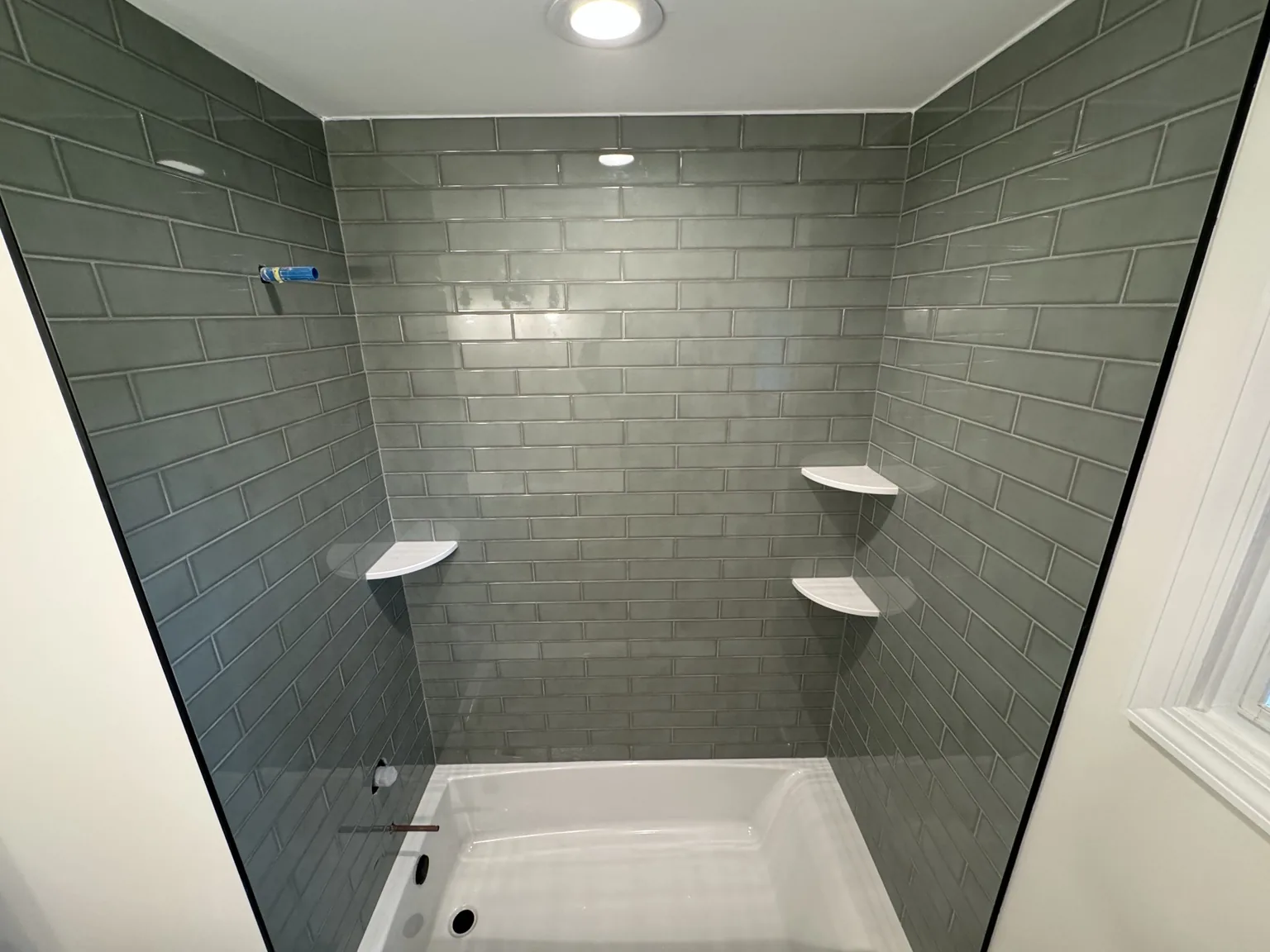 Green subway tile tub surround