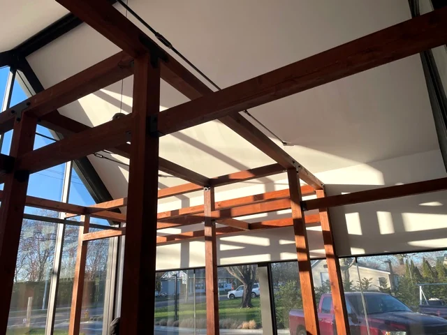 Timber frame inside glass structure